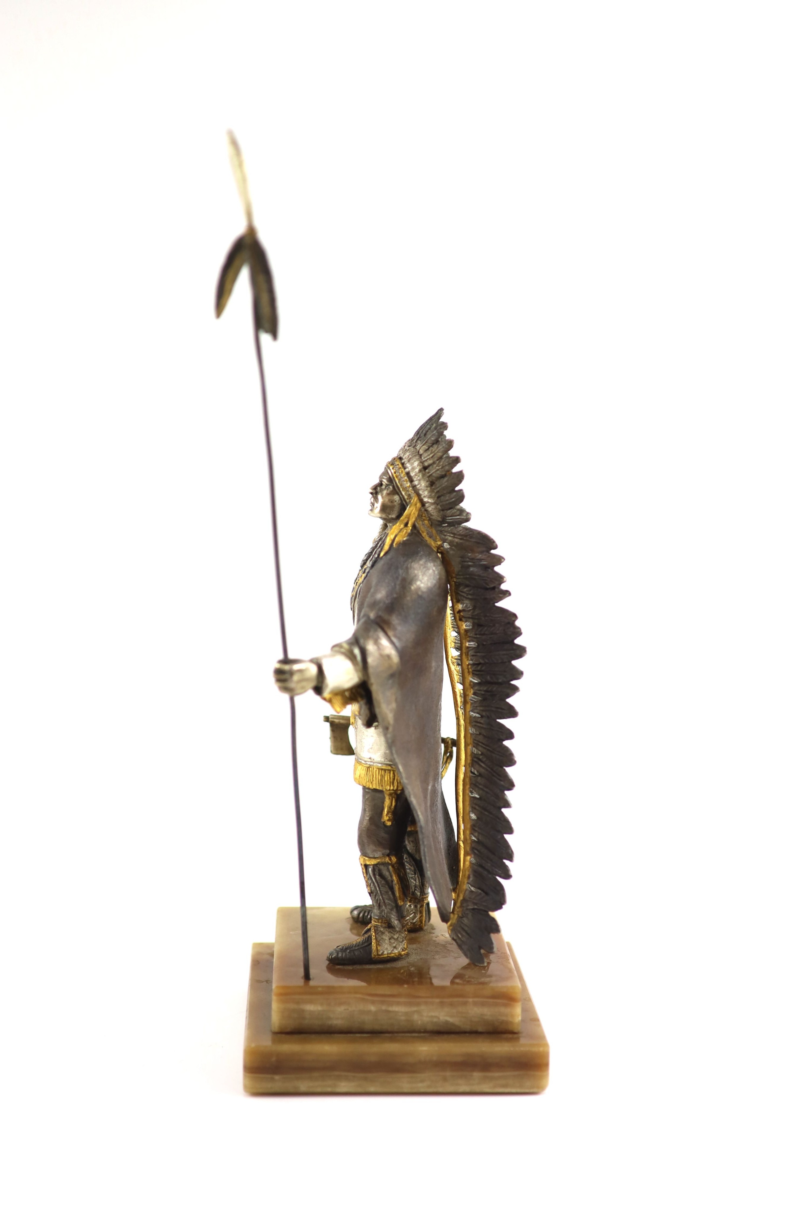 After Carl Kauba, a gilded, silvered and patinated bronze figure of a Native American chieftain, H 36 cm. (from tip of spear)